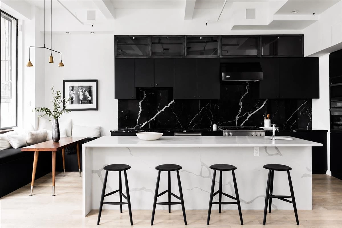 Black marble kitchen with handleless black cabinets