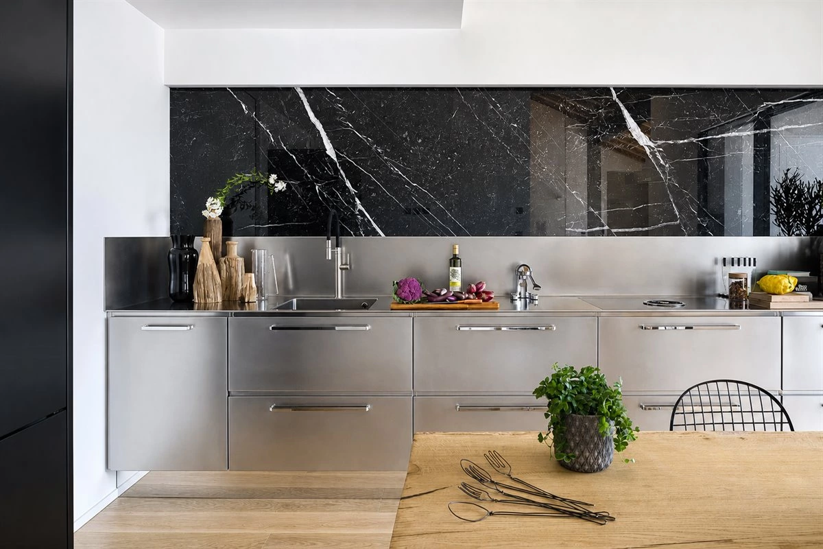 Modern Stainless Steel Kitchen With Integrated Sink Modern stainless steel kitchen with integrated sink, stone and wood finishes