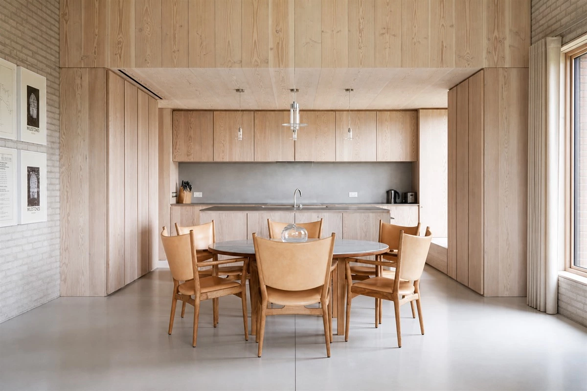 Pure minimalist kitchen with pale brick concrete and Douglas fir