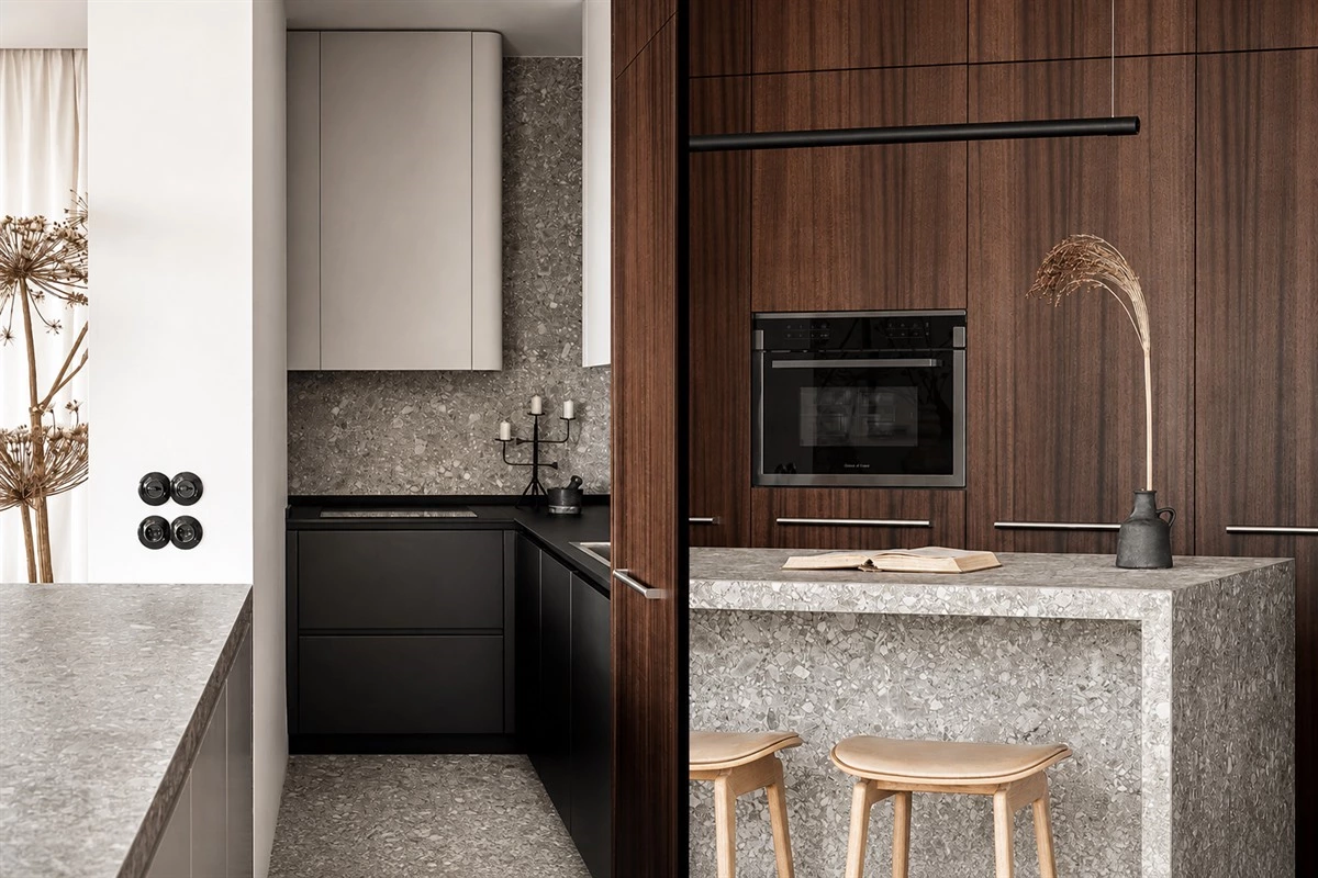 Curved-end eat-in kitchen with streamlined cabinet fronts