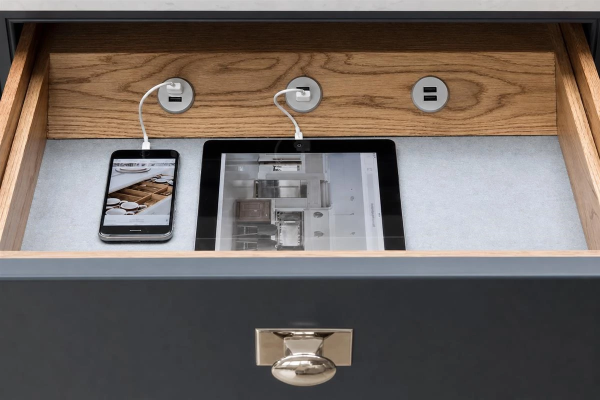 Hidden power outlet solution for a clean modern kitchen surface