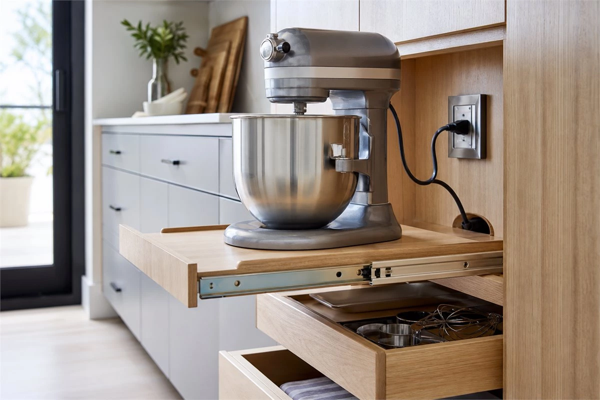 Pull-out appliance shelf with kitchen cabinet outlet and storage drawers