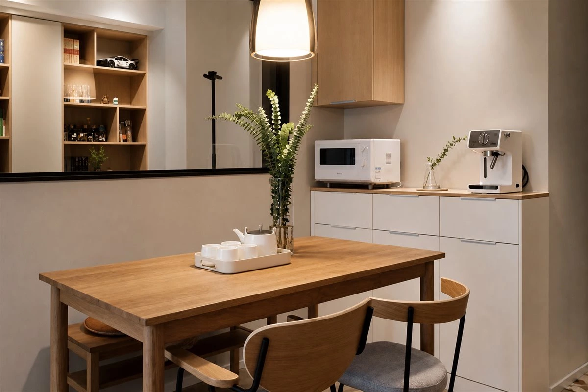 Compact booth dining area with custom sideboard and integrated storage