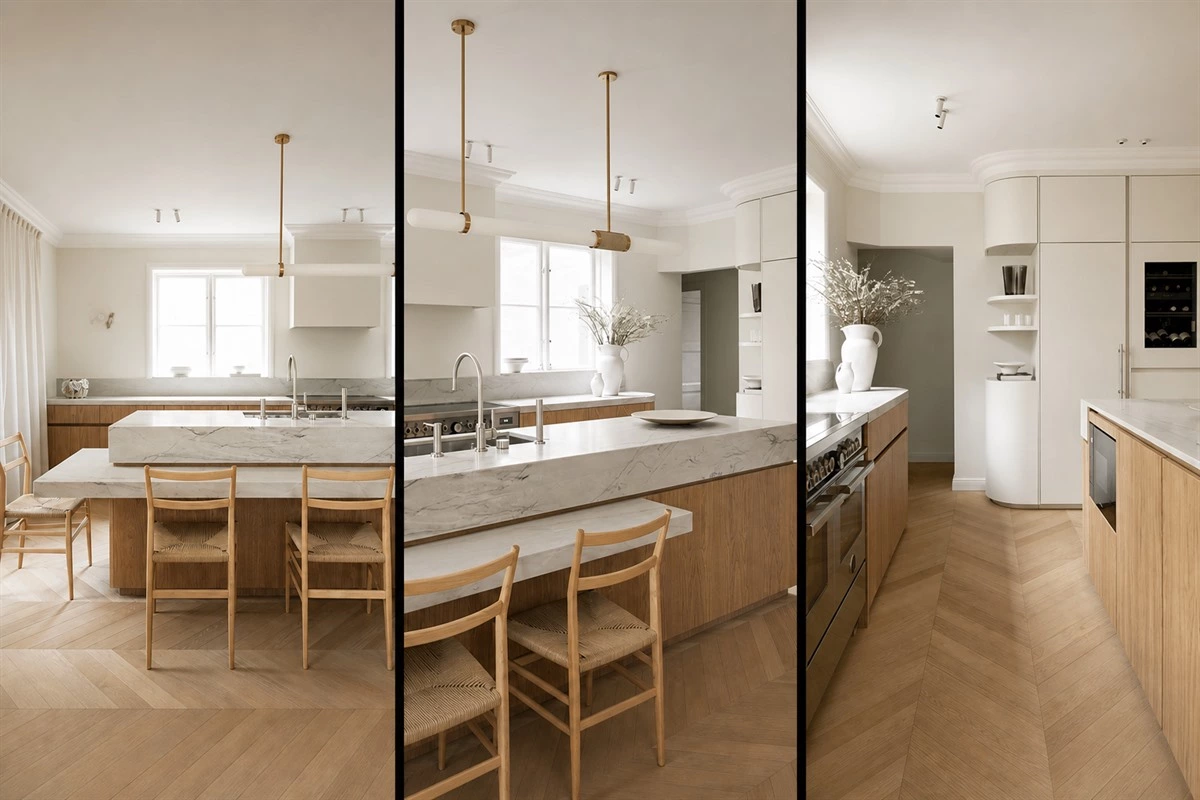 Two-tier island with marble and warm wood in an apartment kitchen