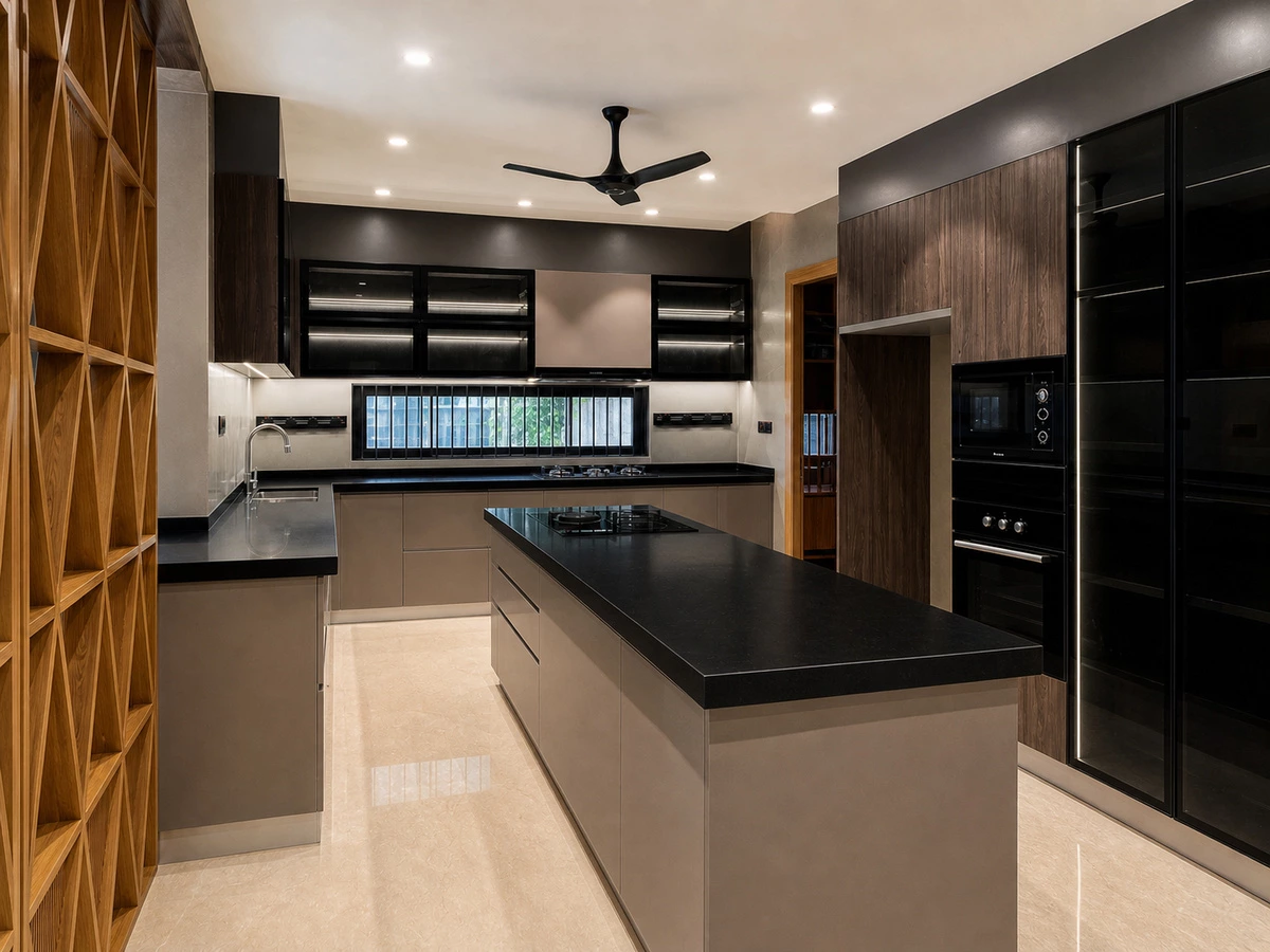 L-shaped black glass kitchen cabinets in an India villa