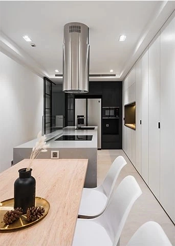 White Kitchen with Grey Island and Dining Table