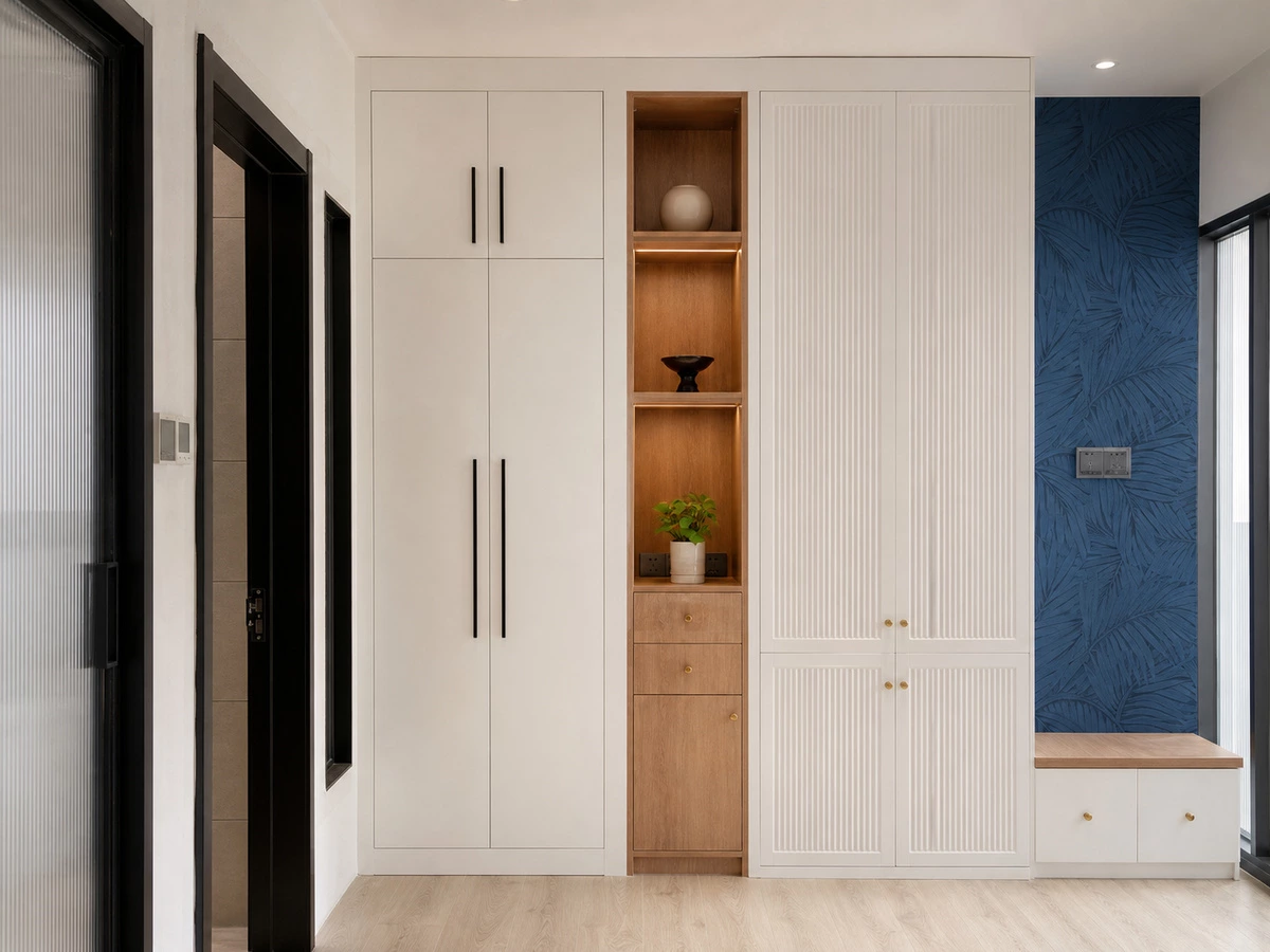White lacquer cabinets with warm wood open shelving in Shenzhen home