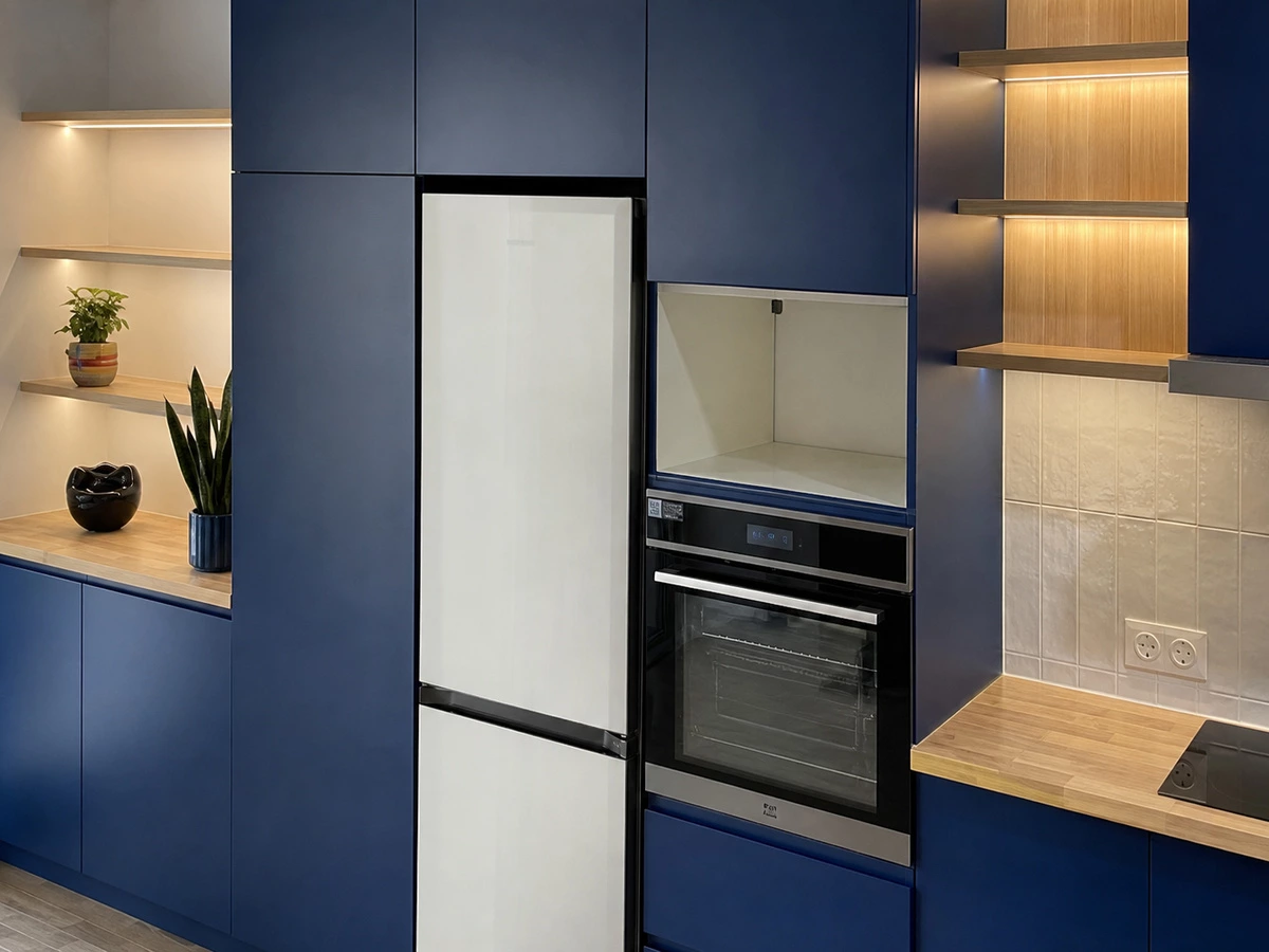 Dark blue kitchen cabinets with an island in the Melbourne apartment