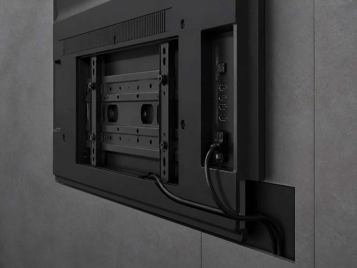 TV wall mount rear port clearance and concealed cable connection detail