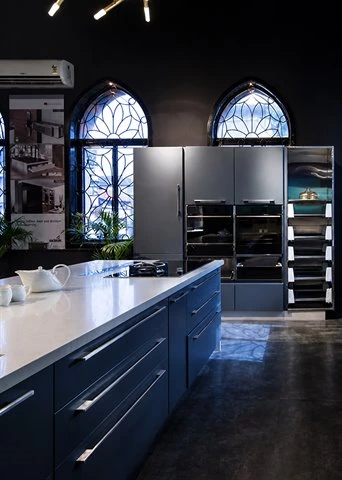 Blue Kitchen Cabinetry with Marble Island