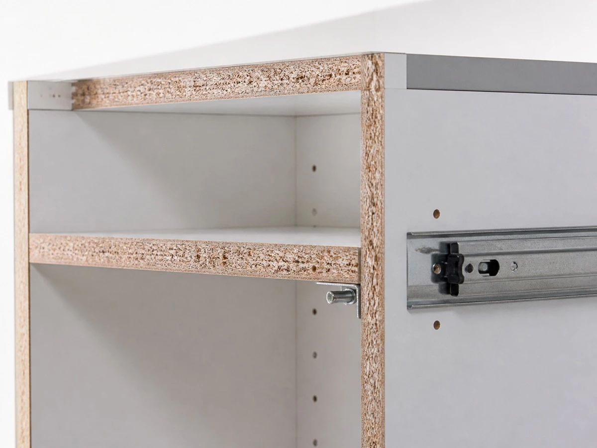 Particle board kitchen carcass with melamine surface edge banding and drawer hardware