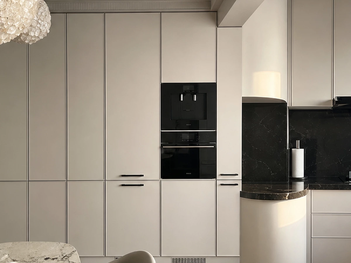 Soft white cabinet finish and curved kitchen detail