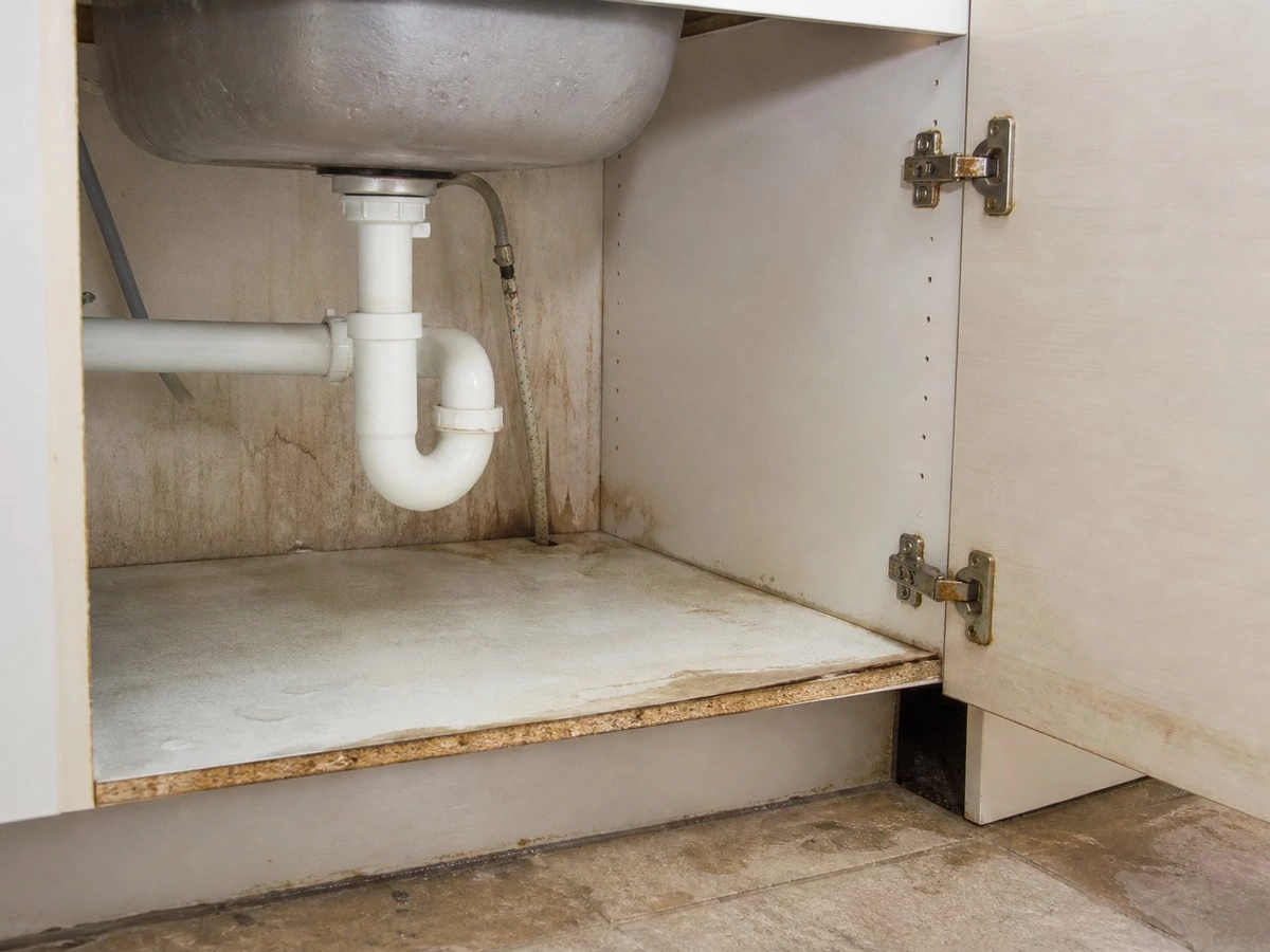 Kitchen cabinet moisture damage risks from leaks unsealed edges humidity and floor exposure