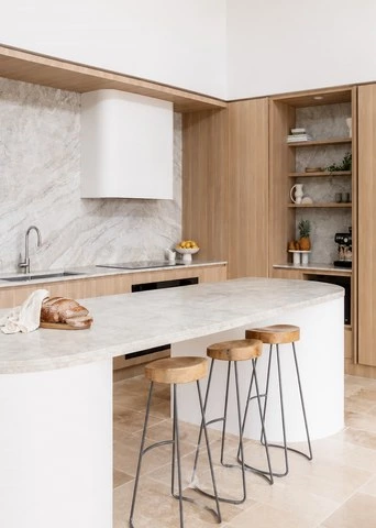 Round Island Kitchen Cabinets in Warm Wood Tones