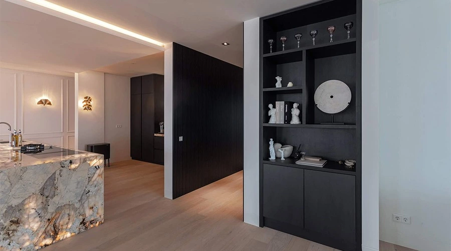 Backlit Stone Kitchen with Matte Black Cabinets