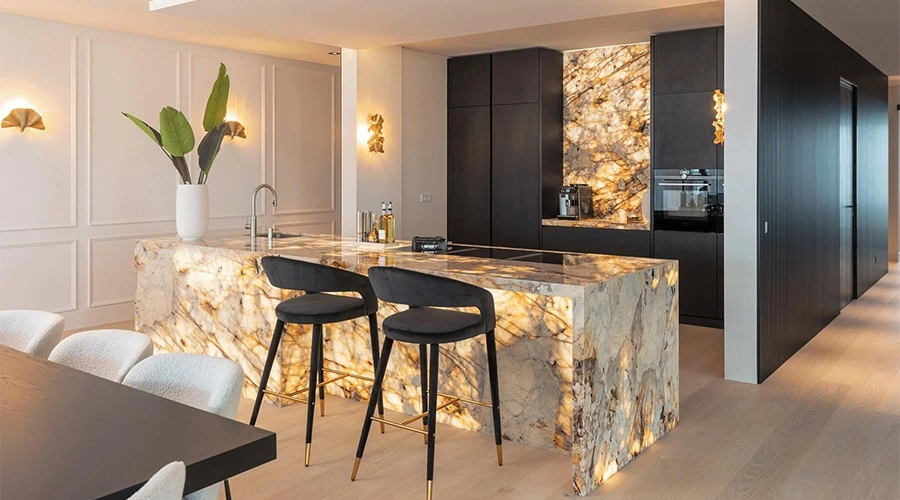 Backlit Stone Kitchen with Matte Black Cabinets