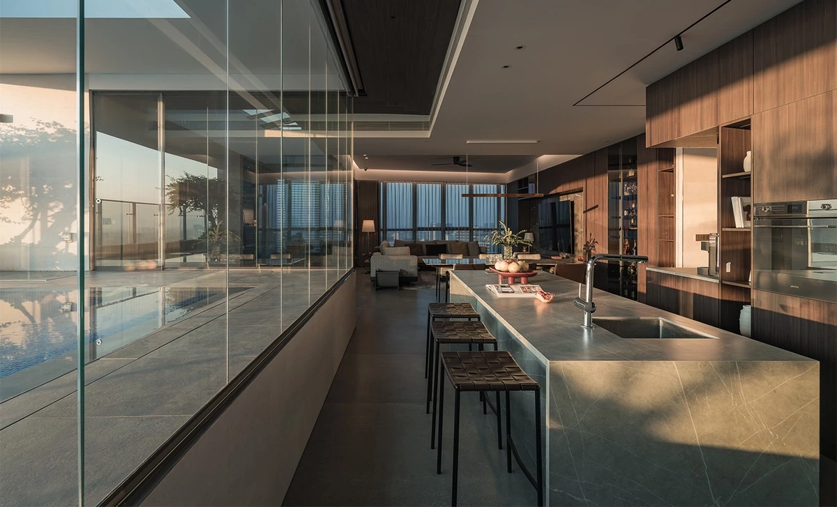 Dark walnut dining cabinetry and media wall with grey stone accents